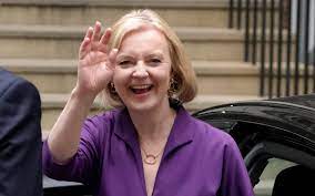 ("Liz Truss )